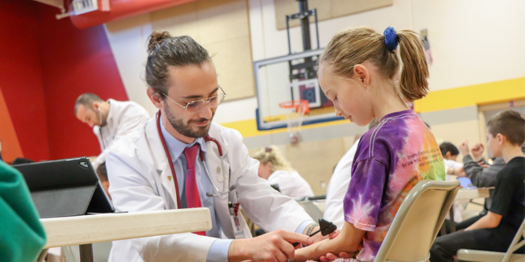 KCU Joplin medical student screen elementary student